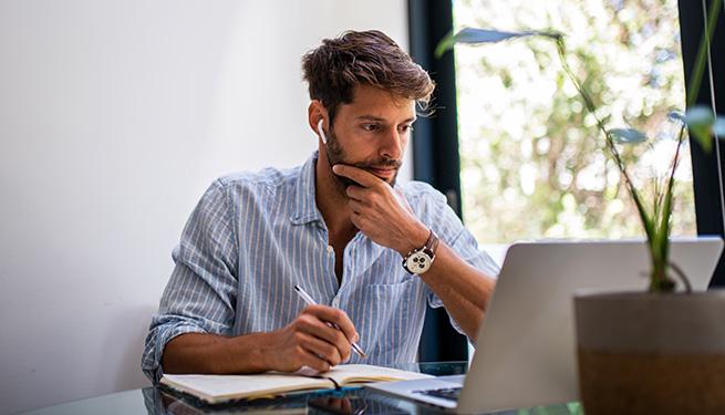 Person working on a laptop in the office